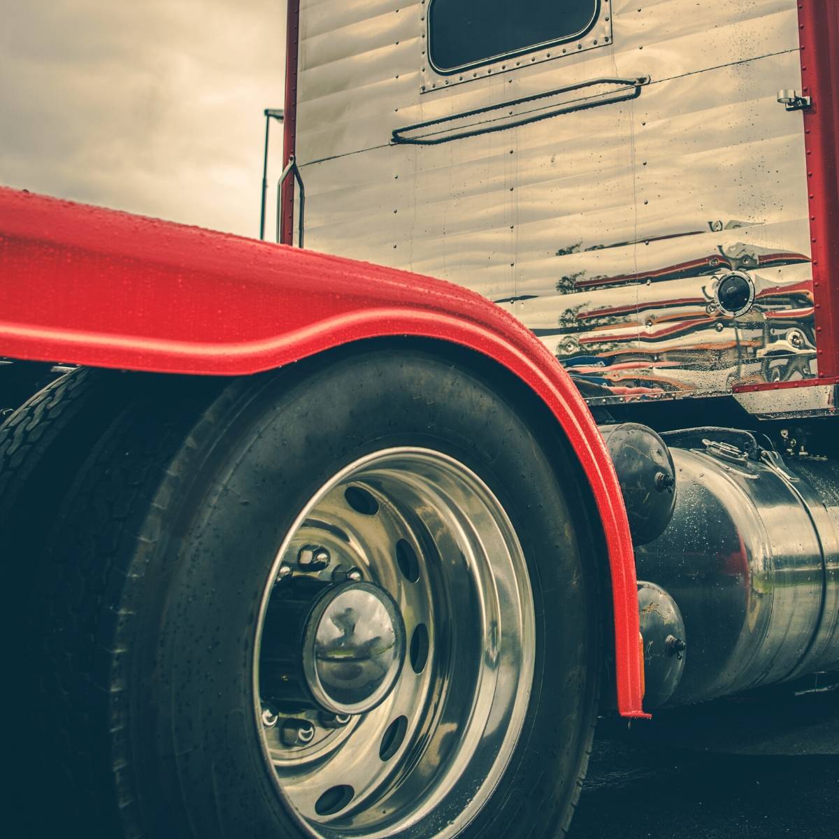 Truck City Service technician inspecting a punctured tire for a patch and plug repair in Greeley, Colorado